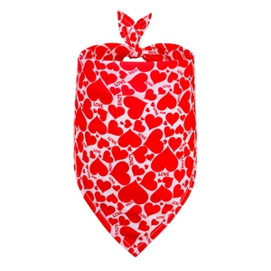 Detailed view of red and white Valentine's heart pattern dog bandana with LOVE text