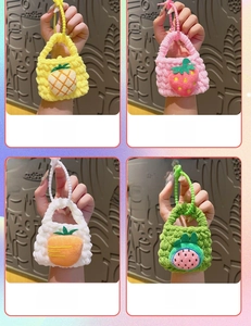 Detailed close-up of handmade knitted fruit mini pouches for coins and small items