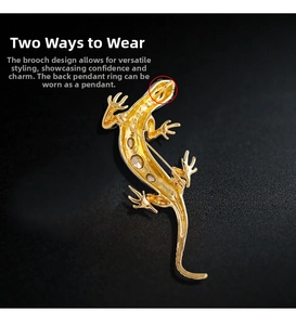 Detailed back view of a lizard brooch with pin and hidden pendant loop in gold finish
