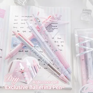 Set of four ballet-style retractable gel pens with decorative ribbons in pink and cream