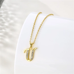 Detailed shot of 18K gold plated letter U pendant necklace with inlaid zircon stones