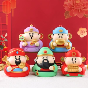 Detailed set of five colorful Chinese God of Wealth figurines with traditional gold ingots
