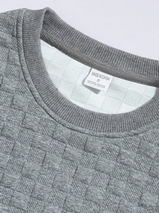 Macro detail of men's slim fit waffle knit grey shirt collar and textured polyester fabric