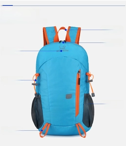 Detail of blue outdoor backpack showing 30KG capacity, dual zippers and orange webbing