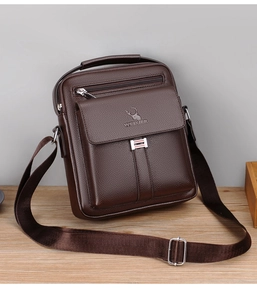 Close-up of brown PU leather men's messenger bag with adjustable strap and textured finish