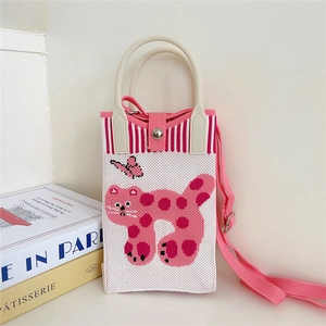 Close-up of white knitted phone bag with pink leopard cat pattern and snap closure