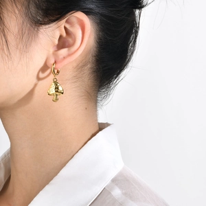 Polished gold mushroom hoop earrings for women with textured vintage pendant design