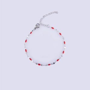 Detail of silver link bracelet with red enamel oval beads and adjustable lobster clasp