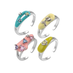 Set of four colorful dopamine enamel rings with bright gemstones and bow design