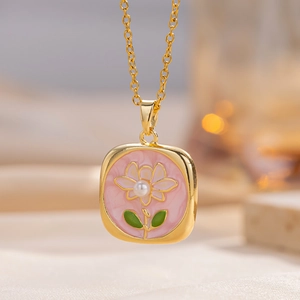 Elegant gold necklace with square pink enamel floral pendant and delicate pearl center