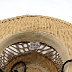 Detail of 100% paper straw hat interior with sweatband, chin cord and size 58 label