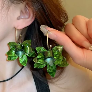 Retro resin flower hoop earrings with dark green petals and gold metal circles