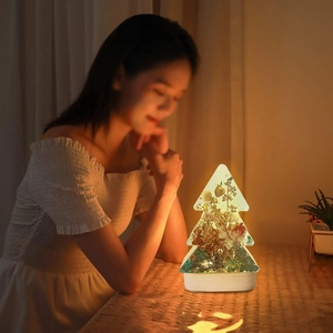 Illuminated Christmas tree resin night light with botanical floral specimens and warm base