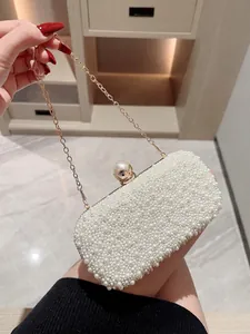 Elegant white pearl evening clutch bag with golden crown clasp and metal chain strap