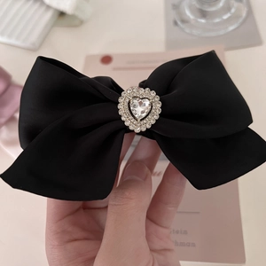 Elegant black satin bow scrunchie featuring a luxury heart rhinestone embellishment