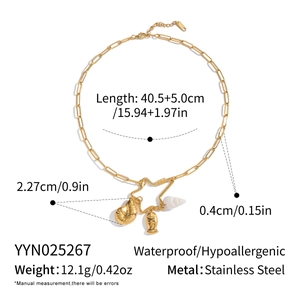 Detail showing 18K gold plated stainless steel necklace with seashell and fish pendants