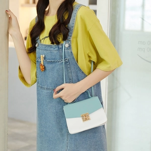 Fashionable contrast color square crossbody bag in light blue and white with gold lock