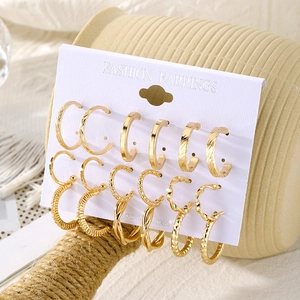 6 pairs of gold hoop earrings set featuring smooth, twisted, and textured C-shape designs
