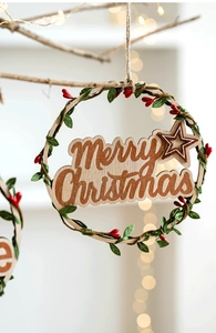 Close-up of wooden Merry Christmas wreath with green leaves and red berries