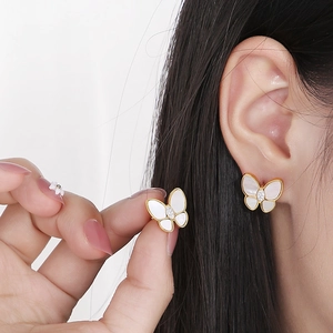 Elegant 3D butterfly stud earrings with shell inlay and cubic zirconia in gold