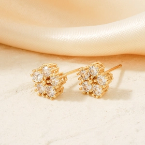 Exquisite gold geometric flower stud earrings with white cubic zirconia stones