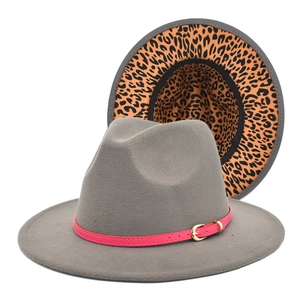 Detail of grey fedora hat with pink leather band and leopard print inner lining