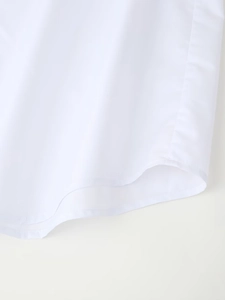 Close-up of high-quality sewing on white shirt curved hem with smooth texture