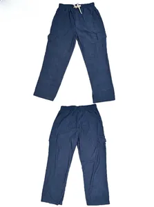 Detail of dark blue corduroy cargo pants showing elastic waistband and large side pockets