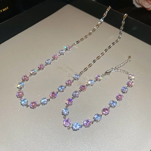 Detail view of pink and white zircon necklace and bracelet set with lobster clasp closure