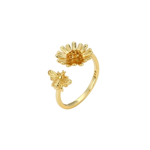 Macro shot of s925 silver sunflower and bee ring with golden plating and zircons