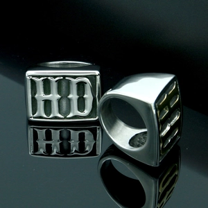 Detailed macro view of silver titanium biker ring with Gothic HD embossed lettering