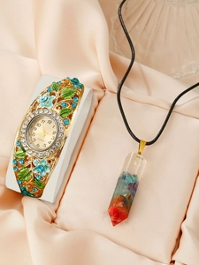 Detailed view of enamel floral quartz watch with a crystal crushed stone pendant necklace