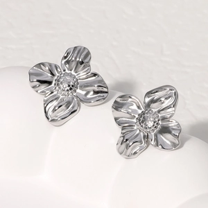 Elegant silver stainless steel flower stud earrings with a textured wavy finish for women
