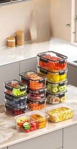 Close-up of airtight food containers with four-sided locking lids for leakproof storage