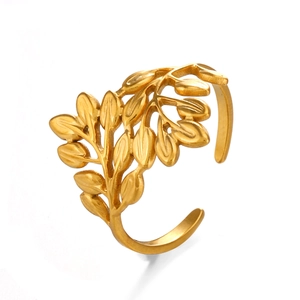 Vintage golden leaf open ring in stainless steel with detailed texture on white background