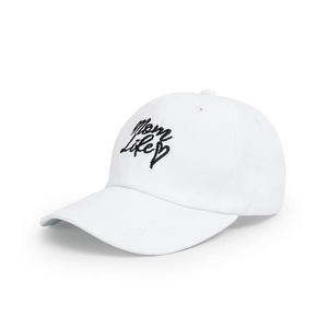 Detail of white cotton baseball cap featuring Mom Life embroidery and black heart