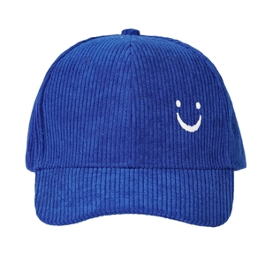 Unisex navy corduroy baseball cap featuring a white embroidered smile face design