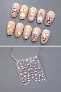 Detailed view of rainbow and unicorn nail stickers set featuring colorful star patterns
