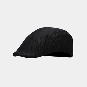 Detailed view of the black breathable mesh fabric texture on the flat top beret cap