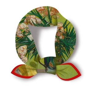 Detail of square silk scarf with Van Gogh oleander print tied in a neat bow