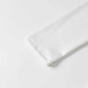 Detailed close-up of white dress sleeve cuff with precise double-needle stitching and fabric
