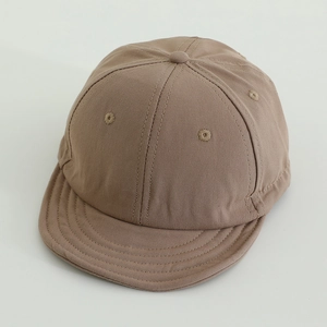 Detail view of khaki cotton short brim baseball cap with soft top and breathable eyelets