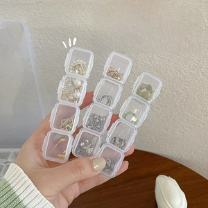 Transparent multi-grid jewelry organizer box with individual lids for earring storage