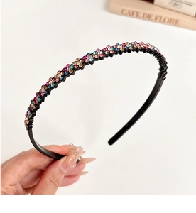 Detail of a black non-slip headband with colorful rhinestones for women hair styling