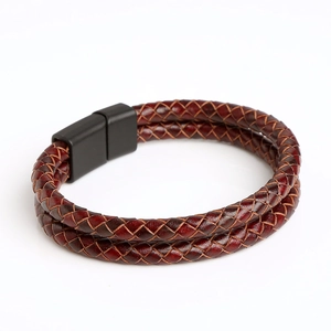 Close-up of a double-layer braided wine red leather bracelet with a black magnetic clasp