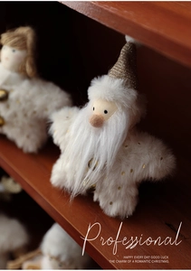 Close-up of white plush star-shaped Christmas gnome with gold sequin hat and long beard
