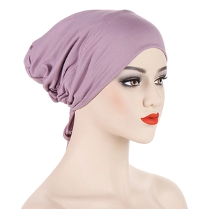 Detail view of purple chemo hat with adjustable drawstring and satin lining texture