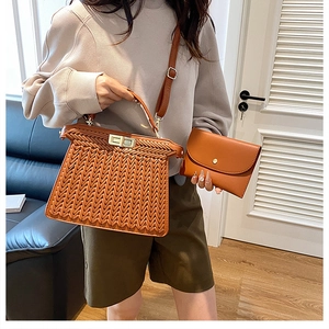 Detail showing the brown woven texture tote and matching smooth leather pouch set