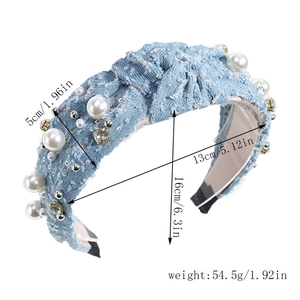 Detail view of denim headband with pearls and rhinestones including size measurements