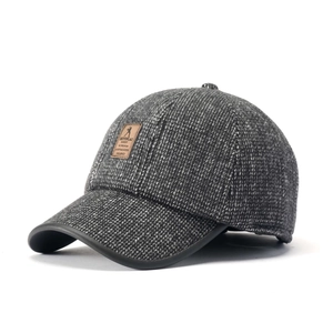 Thick winter baseball cap for men featuring dark gray knit texture and leather patch